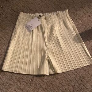 Bought from Israel. Only sold one day. Gold fancy shorts.